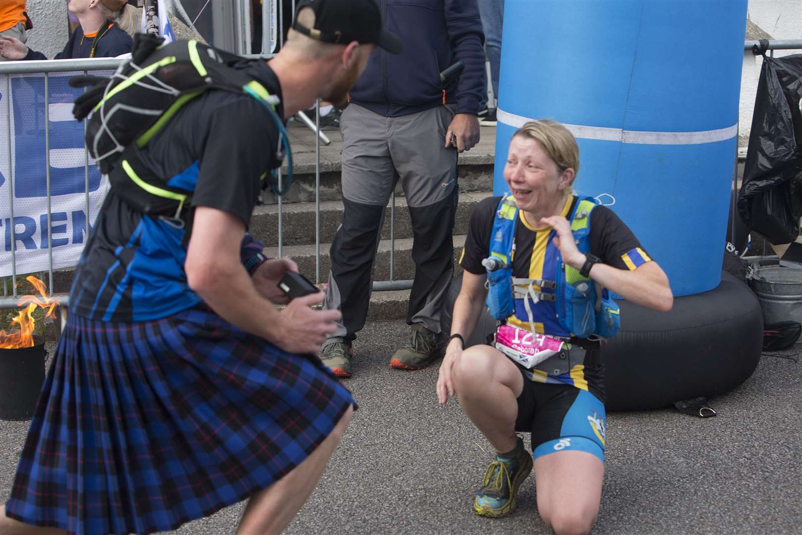 Thurso woman, Debbie Larnach was already emotional having just completed her first Celtman Extreme Scottish Triathlon, in Wester Ross at the weekend, but the emotions got even greater when her partner of six years, Steven Munro, got down on one knee at the finishing line and proposed to her. Debbie said, " It was a complete surprise I never ever though we would be married". But Steven, a scaffolder at Dounreay, had been planning the proposal for some time. Debbie was going to take part in the Canadaman Extreme Triathlon in Canada last year and Steven had planned to pop the question there. But his plans were thwarted when Debbie had to postpone her participation in that event. The couple have five children between them and Steven explained it had all worked out for the best, "If we had gone to Canada it would just have been the two of us, but this worked out better as the children could all be at the finish line at Torrodon and share in the moment." Photo: Robert MacDonald/Northern Studios