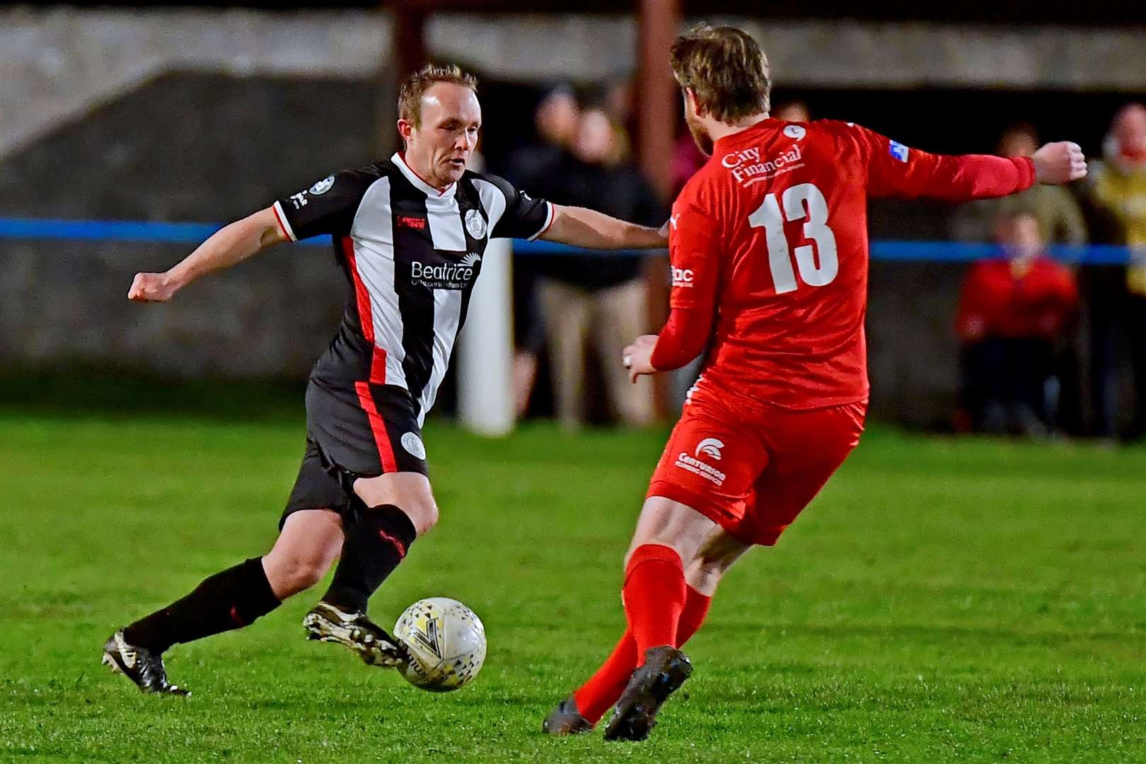 Wick Academy midfielder Richard Macadie swerves past Brora's Dale Gillespie at King George V Park. Picture: Mel Roger