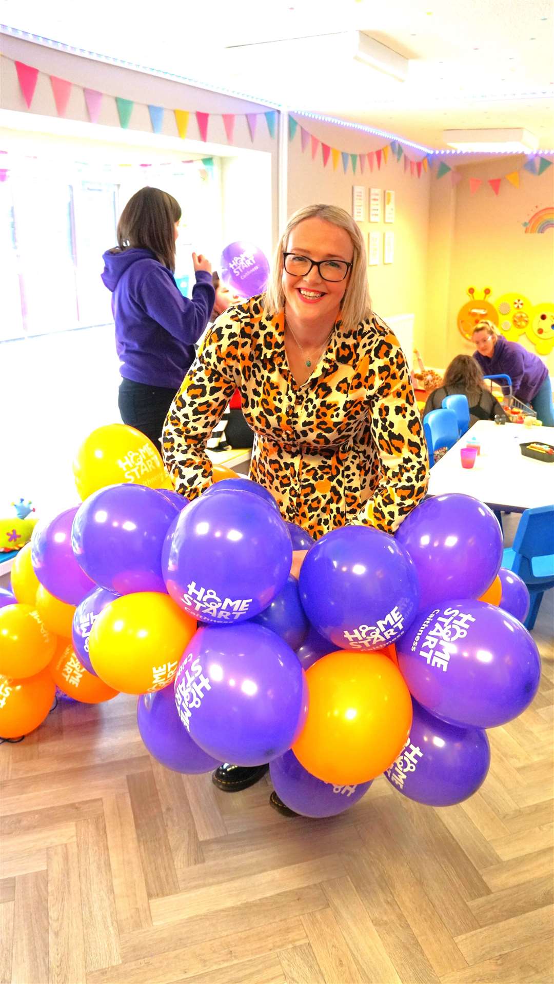 Home-Start Caithness manager Fiona Carlisle ties up balloons for the grand opening event. Picture: DGS
