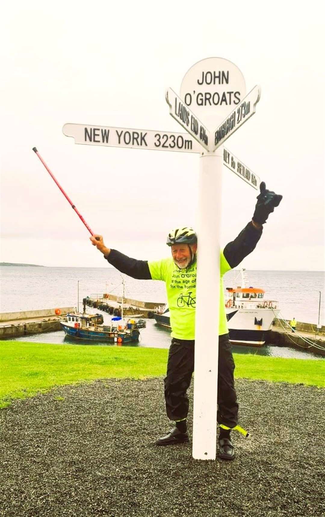 A jubilant Peter celebrates at John O'Groats after finishing the gruelling cycle run on September 21. He uses a walking stick due to arthritis but says he is fine when he cycles.