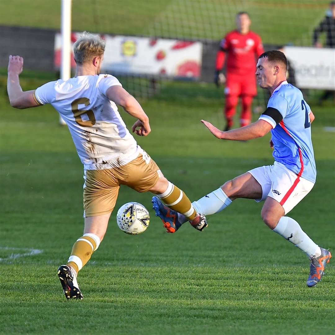 Wick's Gordon MacNab and Huntly's Ross Still go for the ball. Picture: Mel Roger