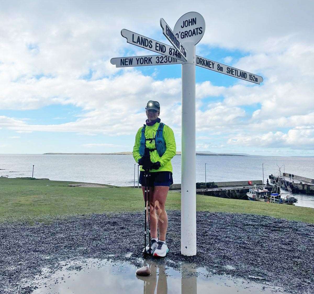 Sara Crosland at the John O'Groats signpost after completing her journey at around 5pm on Tuesday.