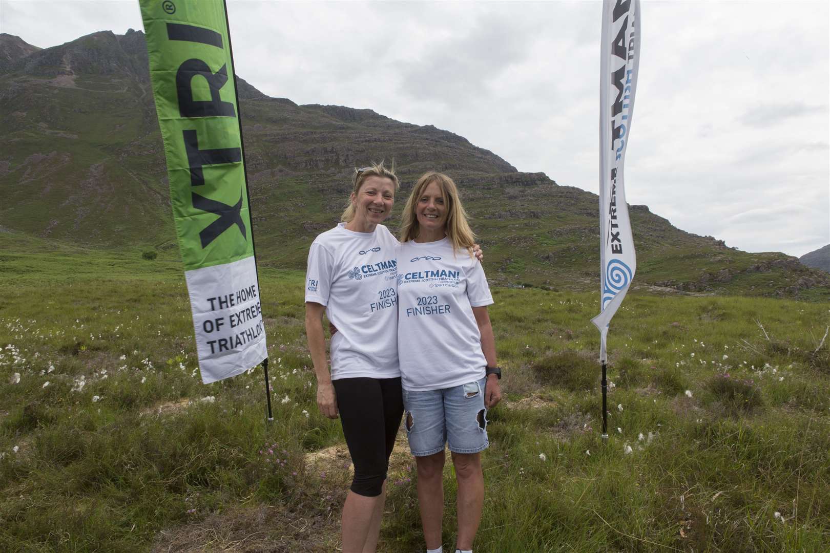 Two Thurso women, Debbie Larnach, (left), and Lorna Stanger have completed the Celtman Extreme Scottish Triathlon held in Wester Ross. For Lorna it was the sixth time she has successfully completed the event, while Debbie was taking part for the first time. Held last Saturday, competitors in the extreme triathlon have to complete a 3.4 kilometer swim in Loch Shieldaig, then take to their bikes for a 200 kilometer ride from Shieldaig on a circular route thats take them through, Kinlochewe, Gairloch, Dundonnell, Garve, Achnasheen and back to Kinlochewe, where they set of on the 42 kilometer run section which is mainly off road on rough ground and tracks around Beinn Eighe and Glen Torridon, finishing at Torridon village hall. There are usually two routes, runners arriving before a certain cut off time at transition point T2a would usually be sent on the higher track while later runners would take a lower route. However this year, unlike the past two years, the weather was hot and calm, but thunder and lighting meant only a handful of the competitors made it to the higher route, before it had to close due to safety concerns. For Debbie, a relief pupil support assistant at Thurso High School, this was her first Celtman and also her first full lenght extreme triathlon. She finished in a time of 14 hours, 58 minutes and 22 seconds. Lorna came home in a time of 16:42:51. Last year she qualified for a red teeshirt marking the fact she had completed the event five times, making her only the second woman to have received the award. For the second successive year Ross Creber, from Scotland was the overall winner in 11.29.38. Twenty-two entrant had to retire from the race, which had a draft entry of 259 competitiors from around the world. Photo: Robert MacDonald/Northern Studios